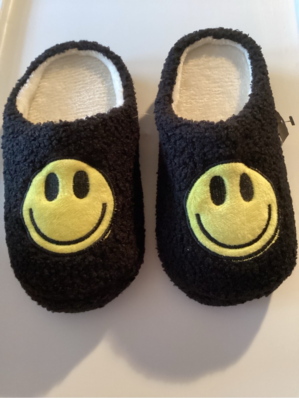 Black Kids Slip-On Slippers with Yellow Smiley Faces 🧩